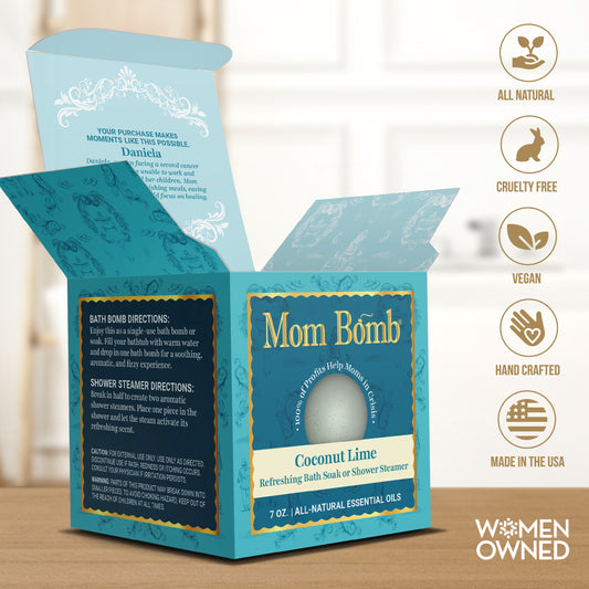 Coconut Lime Bath Bomb box opened on spa counter with women-owned and all-natural product icons.