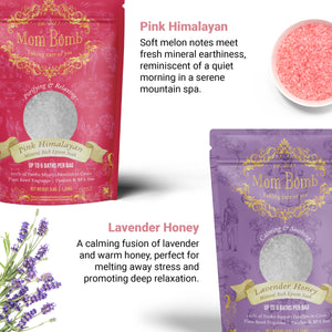Flat lay of Mom Bomb Lavender Honey and Pink Himalayan bath salts with ingredients like lavender sprigs and pink salt, labeled with their scent and wellness benefits