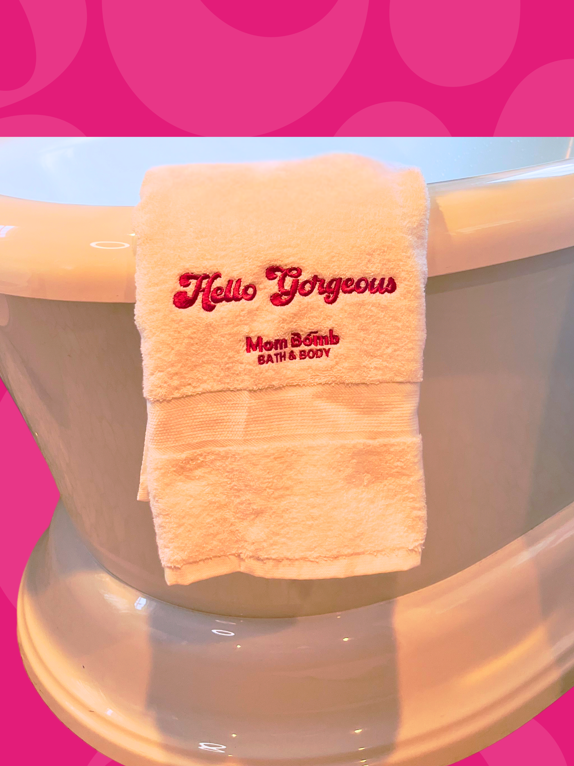 Close-up of the Hello Gorgeous embroidery in Mom Bomb pink on white Turkish cotton